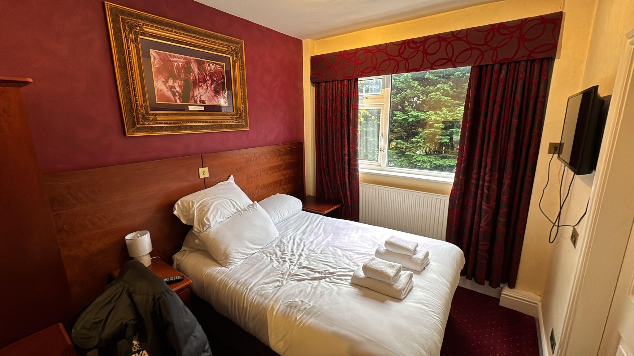 Cold draughty bedroom in poor condition 