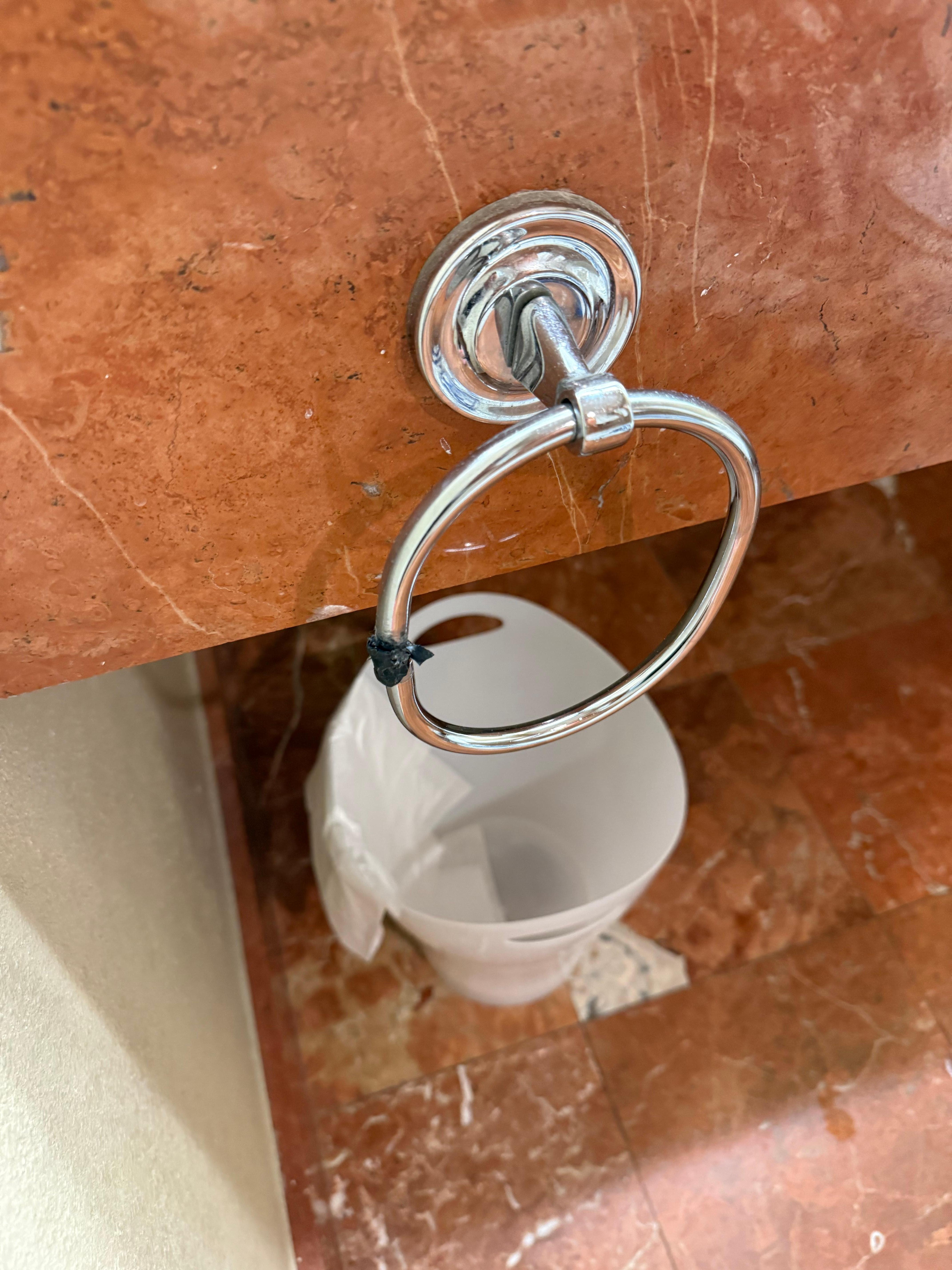 Electrical tape…just buy a new one!  The pocket door would lock and hard to unlock. 