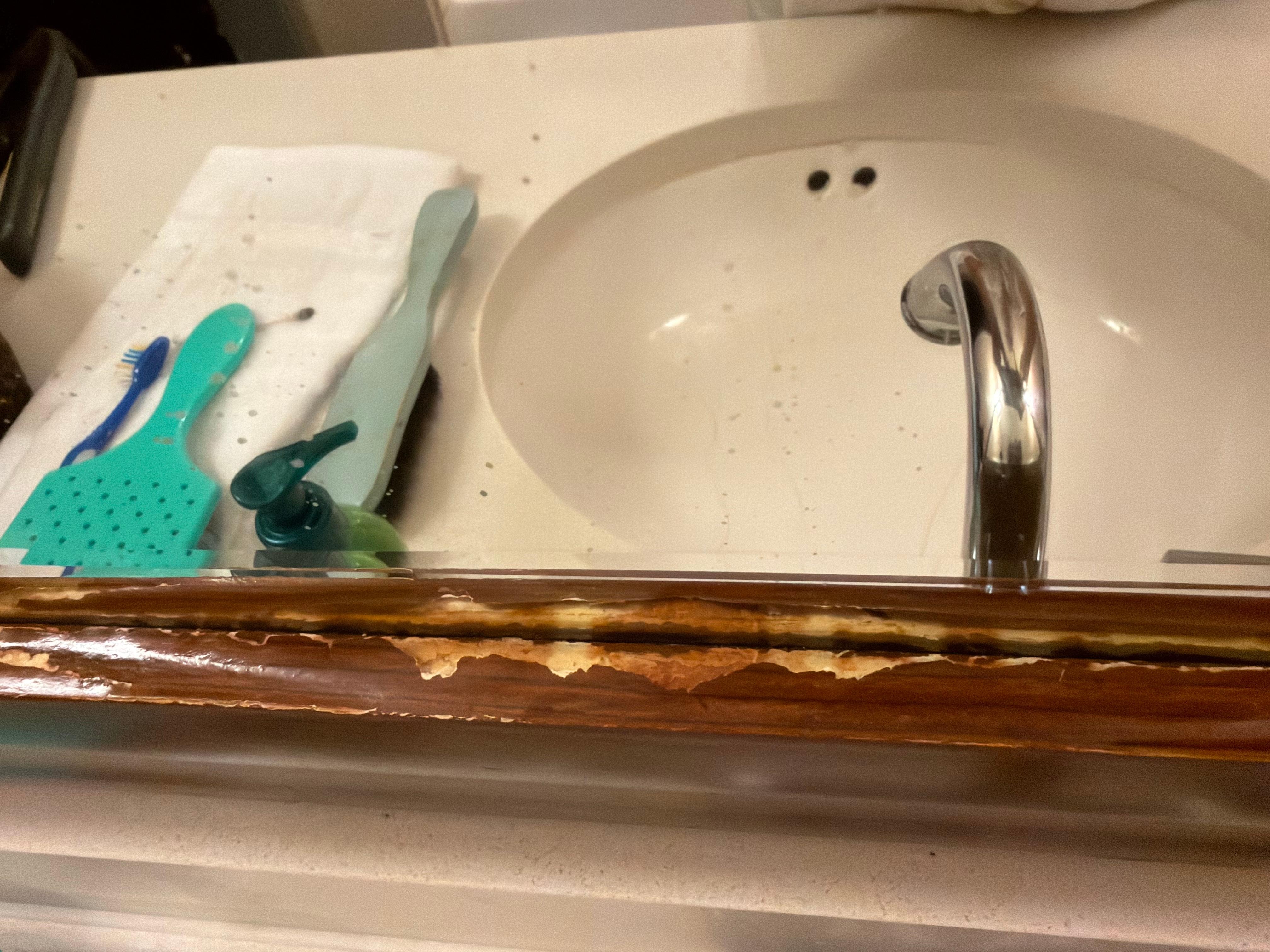 Flaming mirror by sink. 