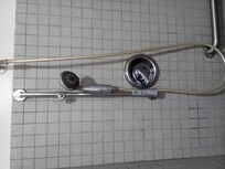 This is the shower sprayer that's duck tapped to the bar that's supposed to hold the sprayer