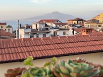 Rooftop patio view to Mt Vesuvius in the distance. Great sunsets too.