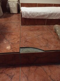 Tiled step in shower room needs serious attention