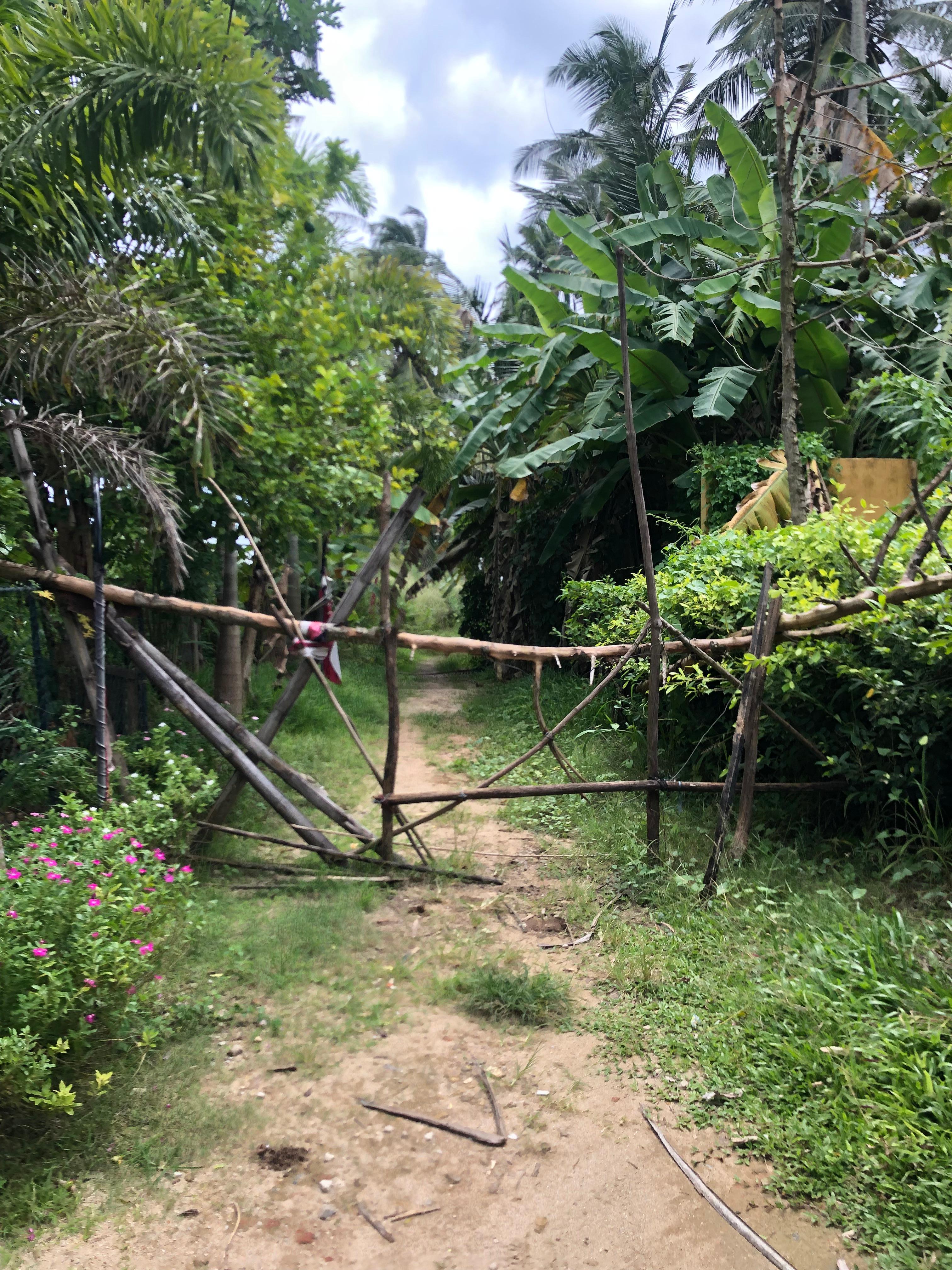 entrance to the hotel with fence barrier we had to climb through for a neighbour to tell us it was closed.