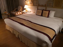 La chambre avec fenêtres sur 2 côté