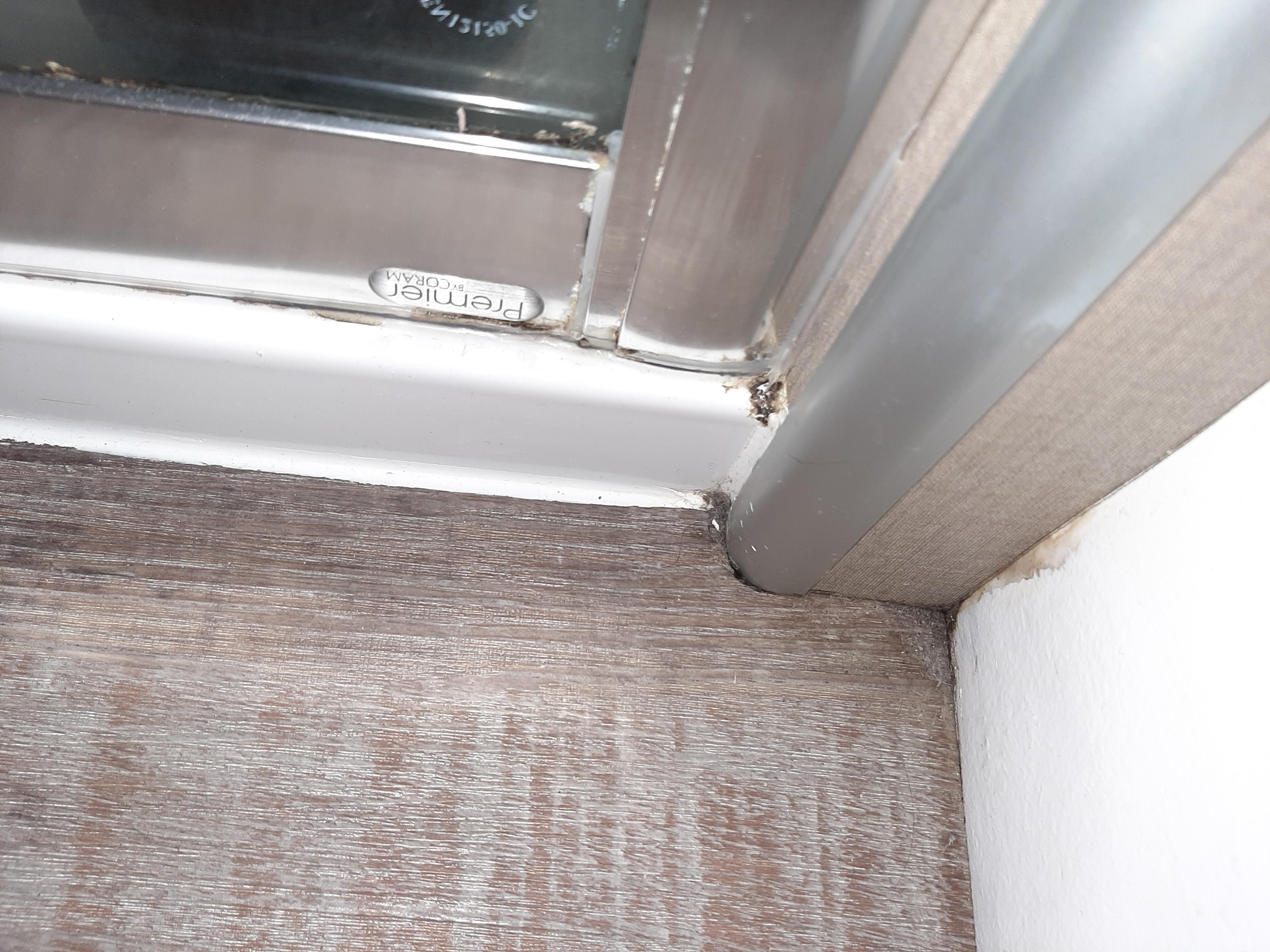 Encrusted dirt all around shower
