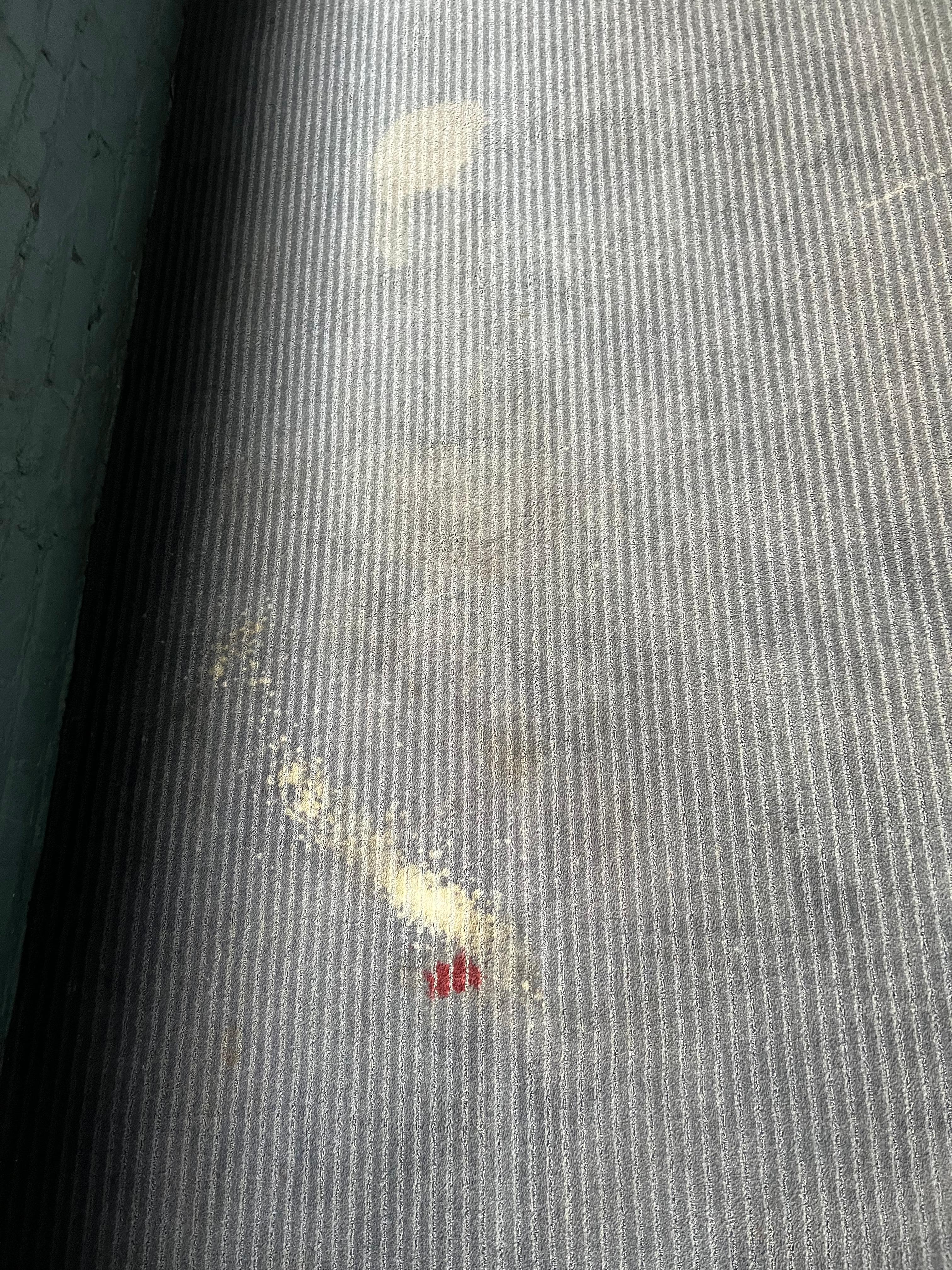 Stain on floor outside the elevator