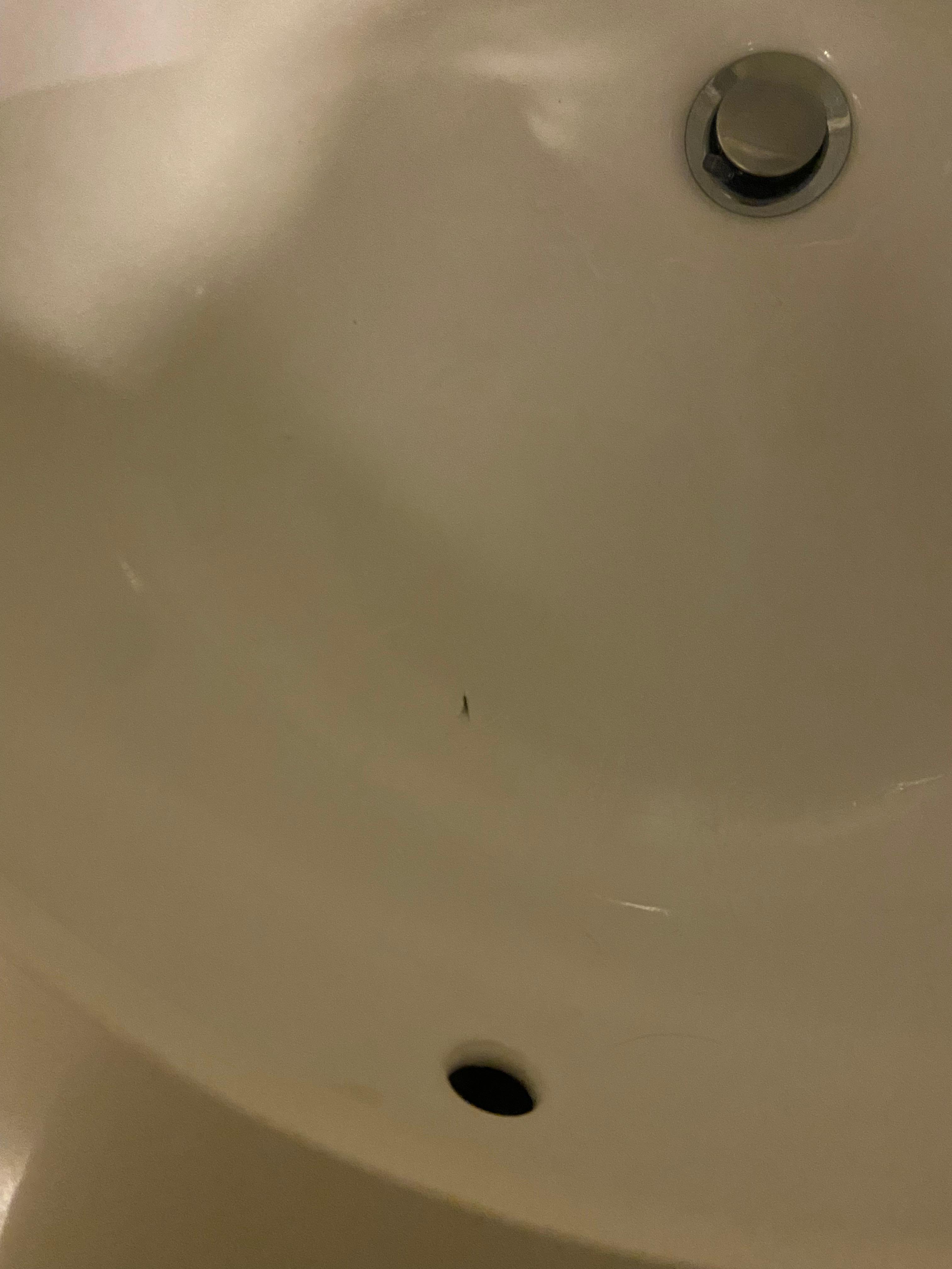 Eyelash extension WITH attached eyelash stuck to the sink