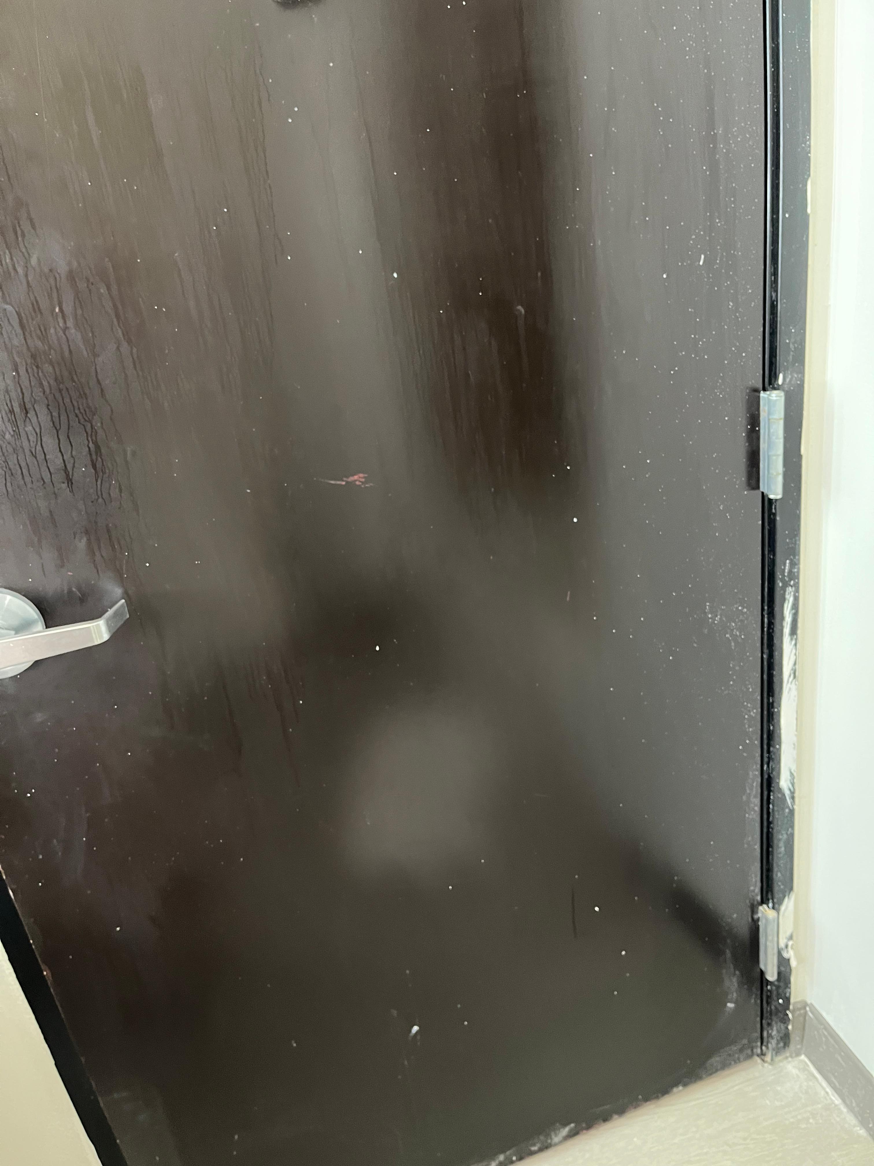 Bathroom door with paint splatter