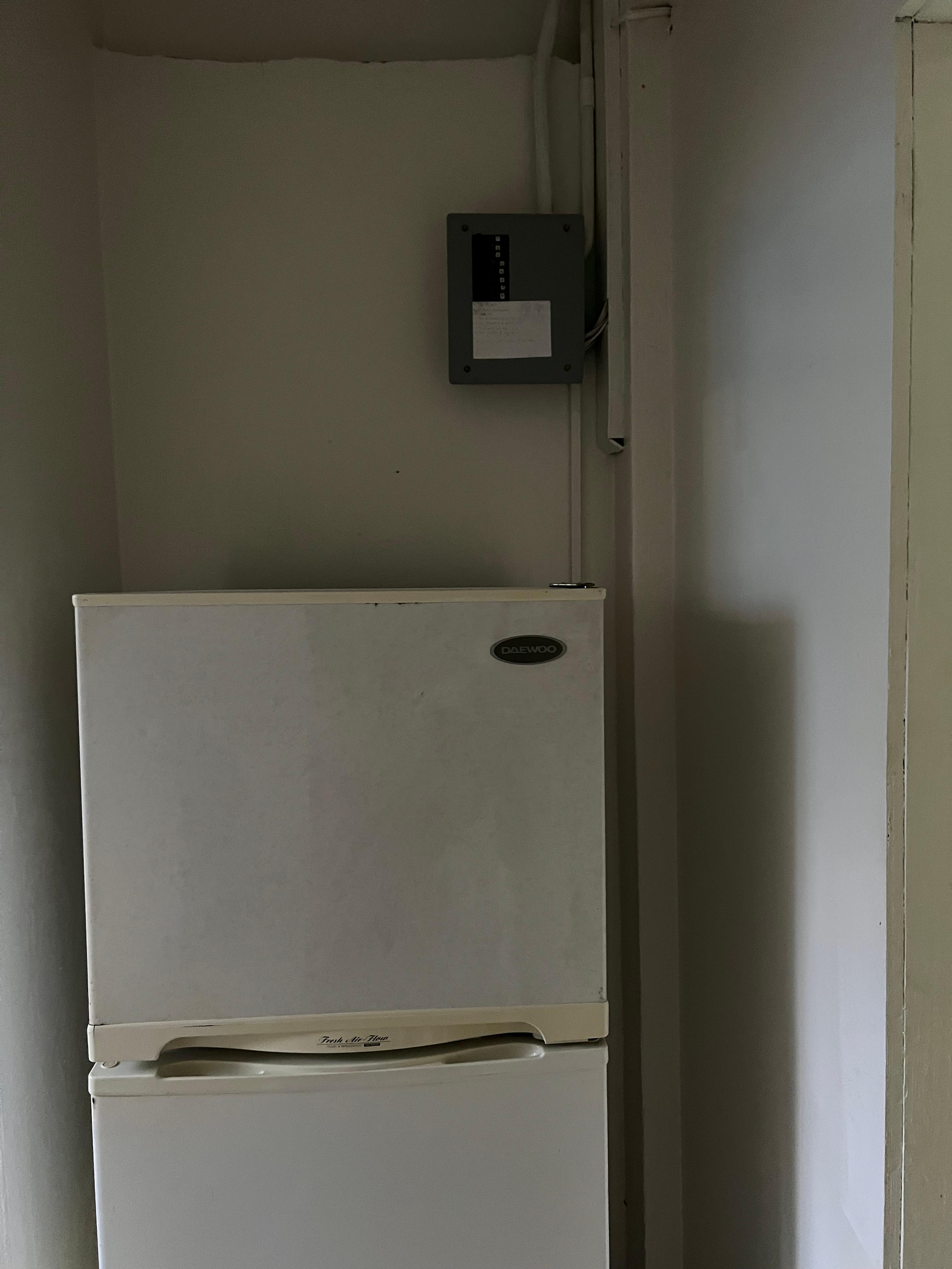 Exposed electric box over fridge 