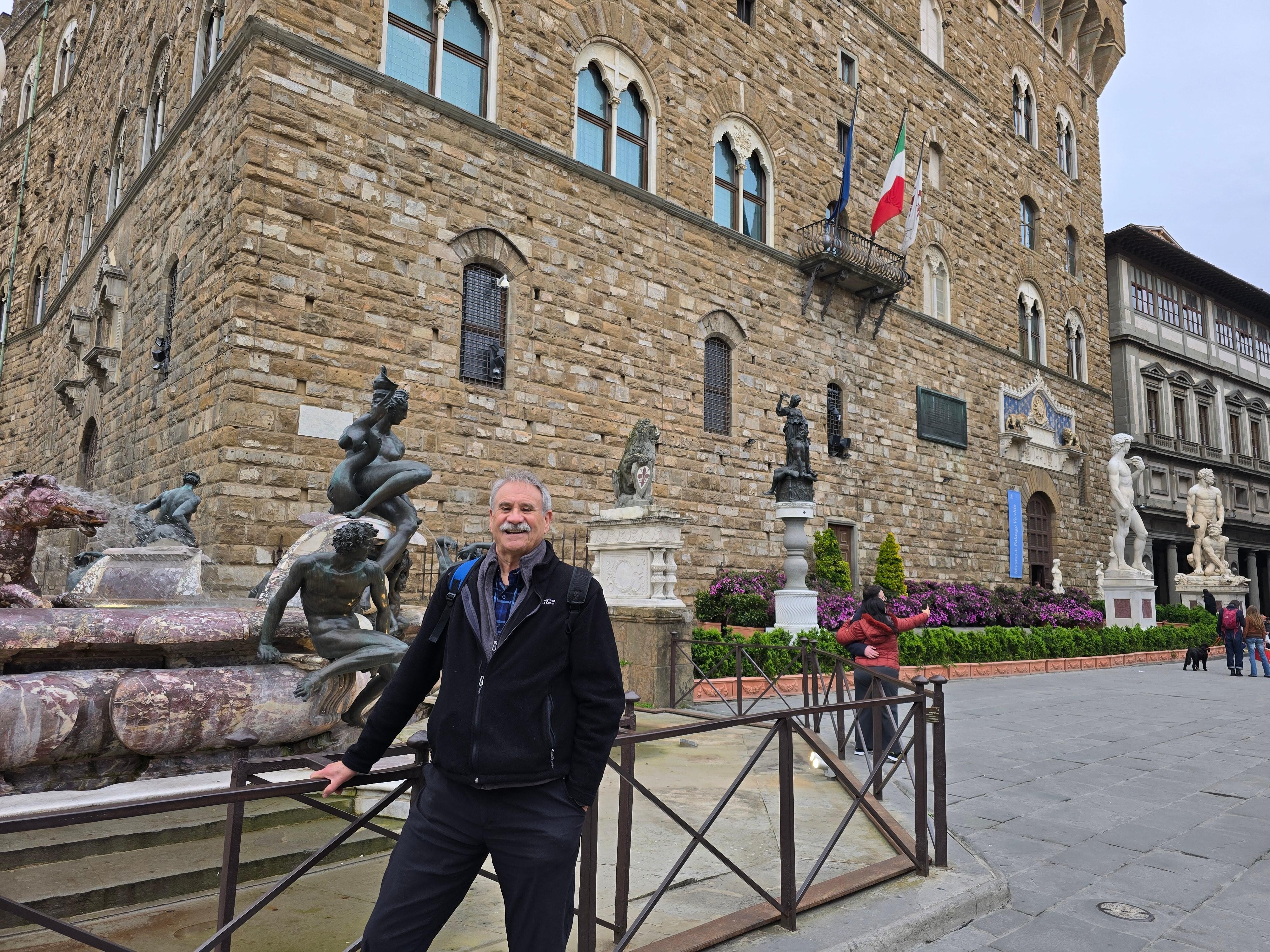 Fountain with statue plaza nearby apartment 