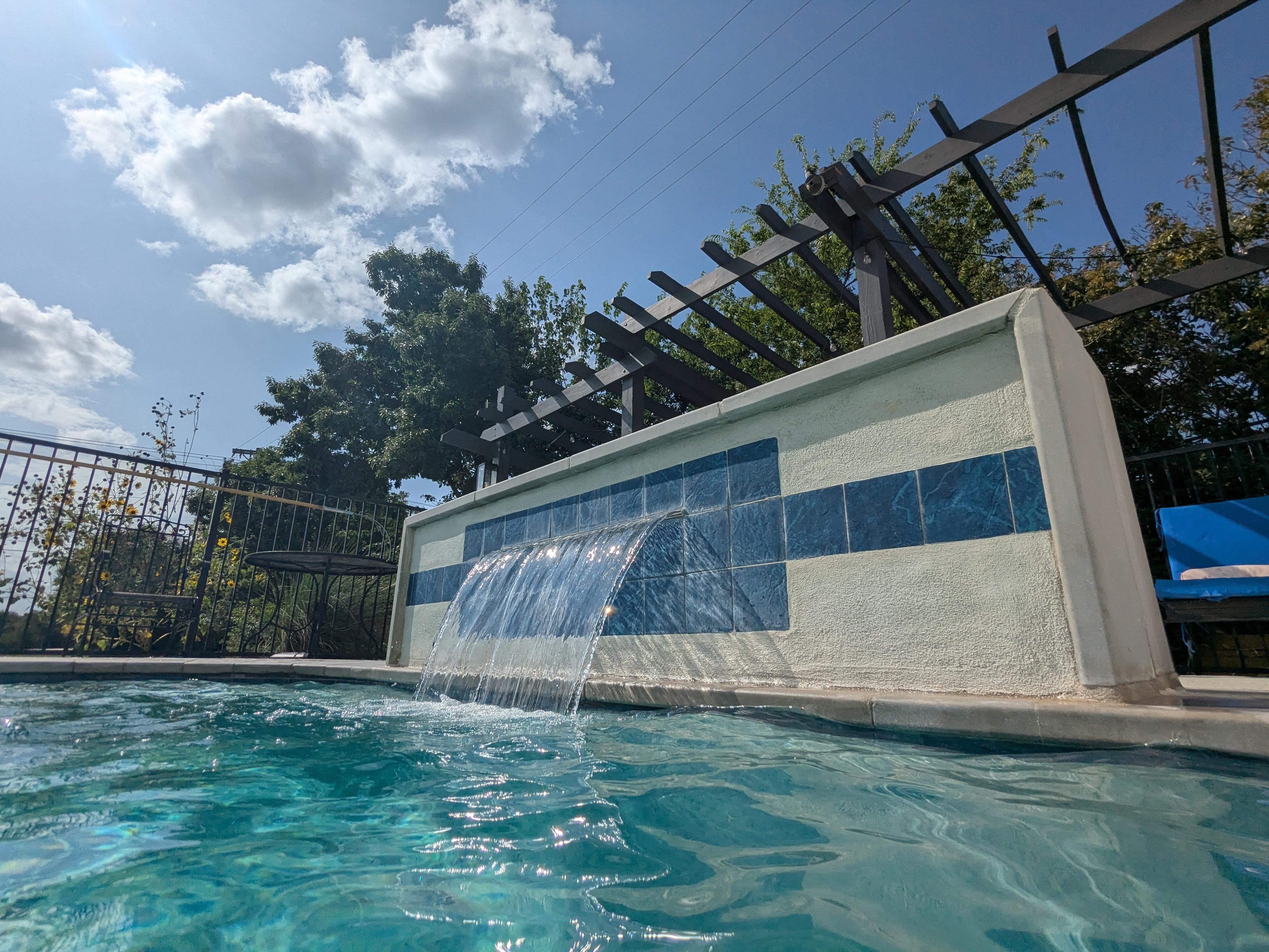 waterfall is a nice addition to the pool. 