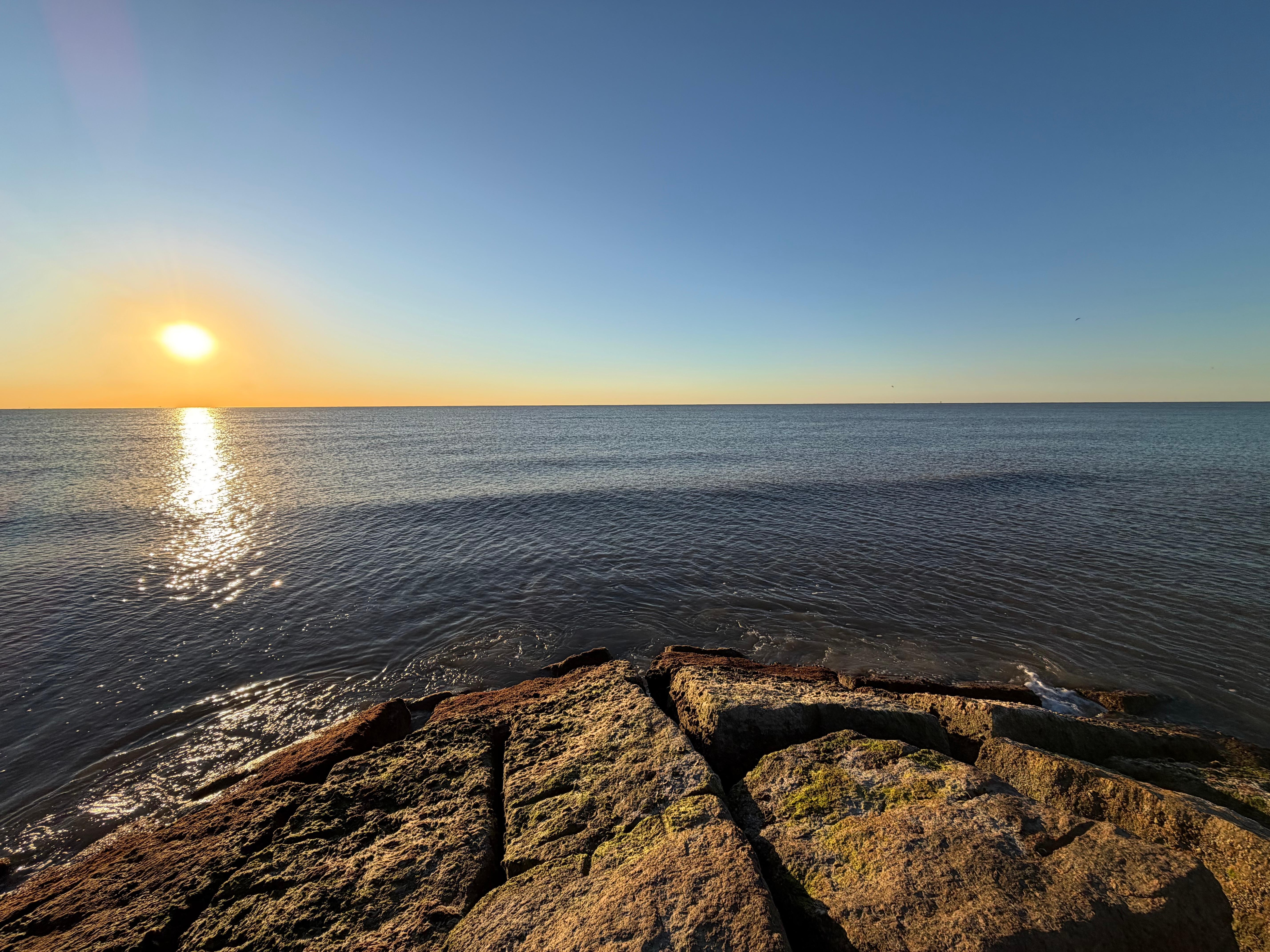 A walk on the short jetty across the street and panoramic view of the hotel and Seawall.