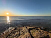 A walk on the short jetty across the street and panoramic view of the hotel and Seawall.