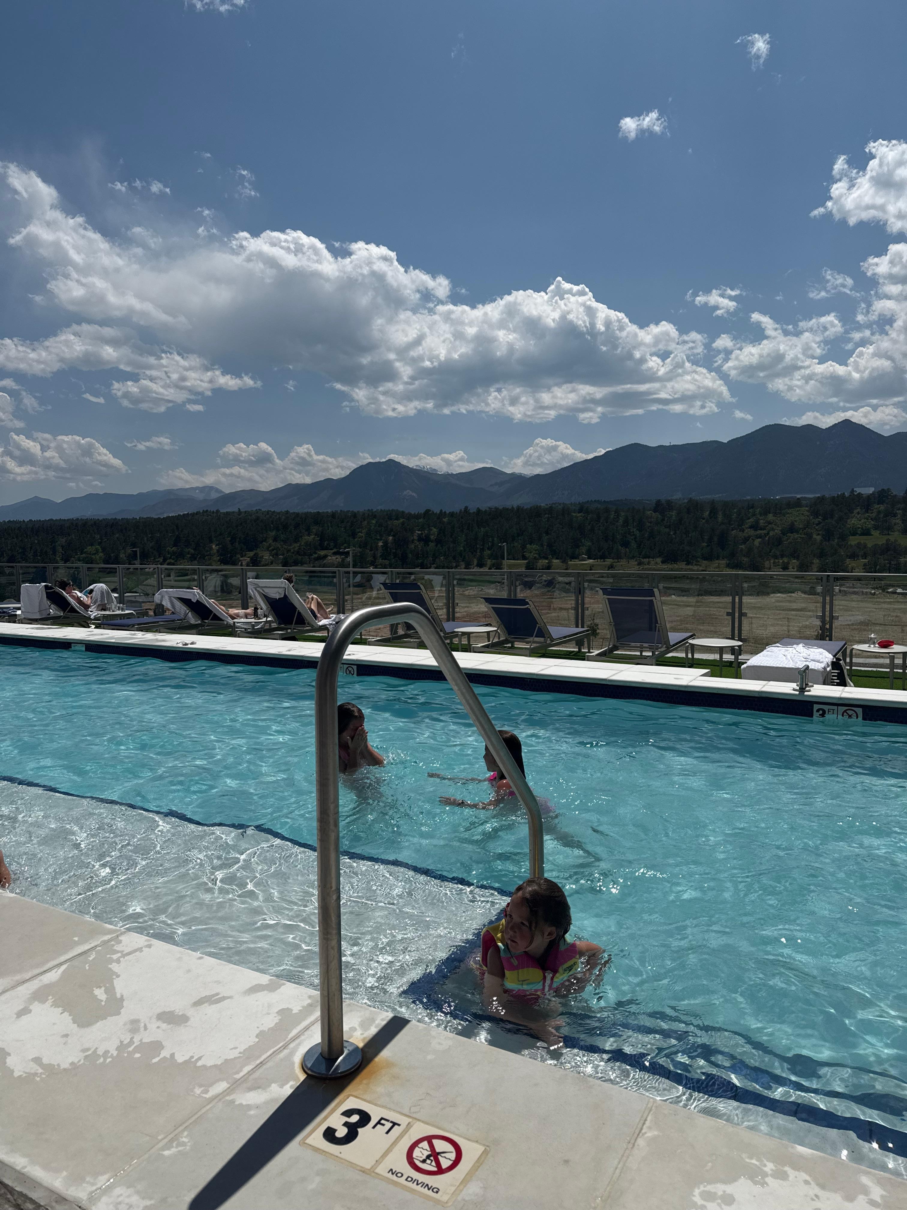 Pool side with a mountain view