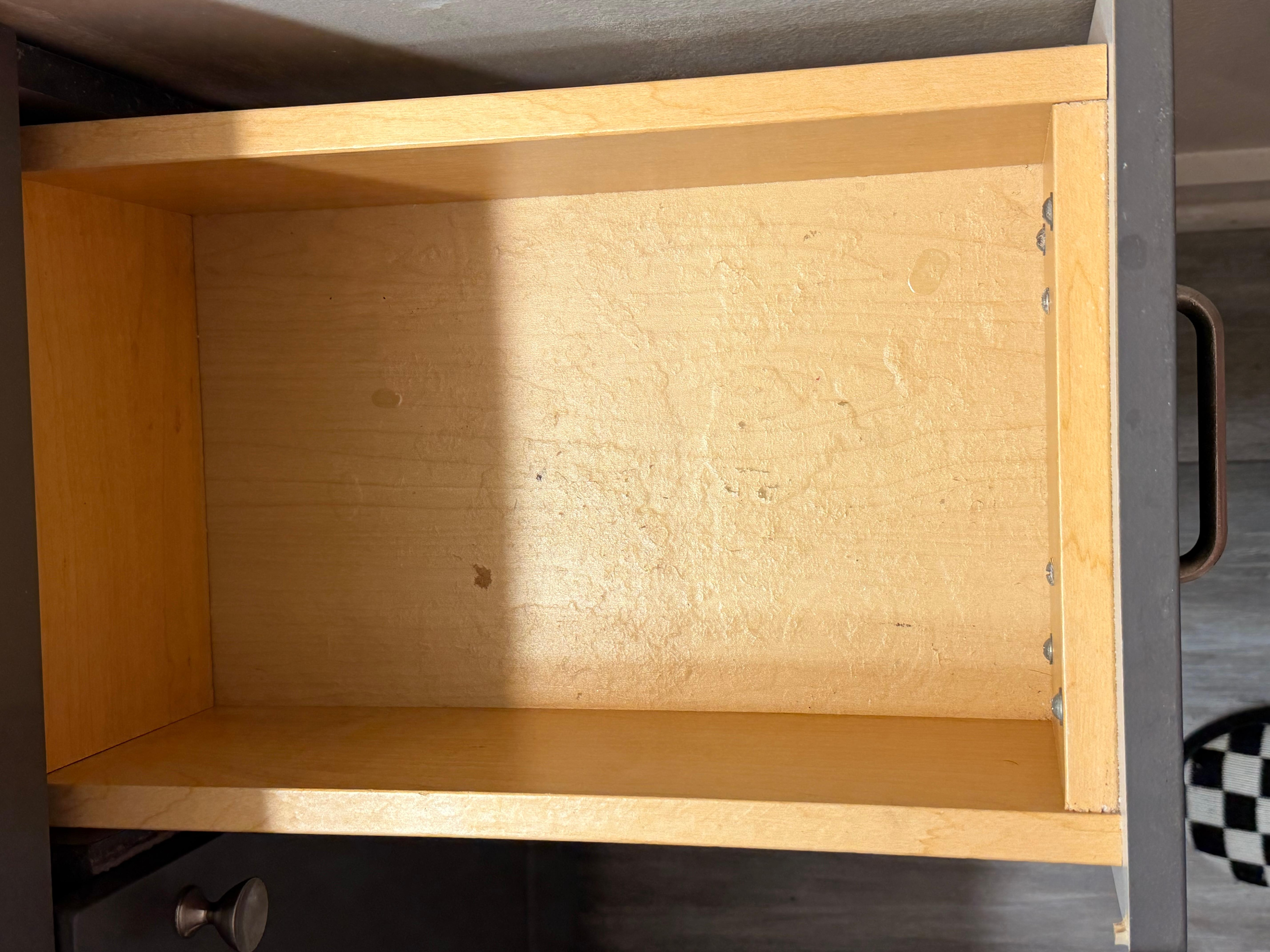 More water damage inside the bathroom drawer connected to the main bedroom.