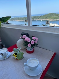 There is a green lizard on the deck!