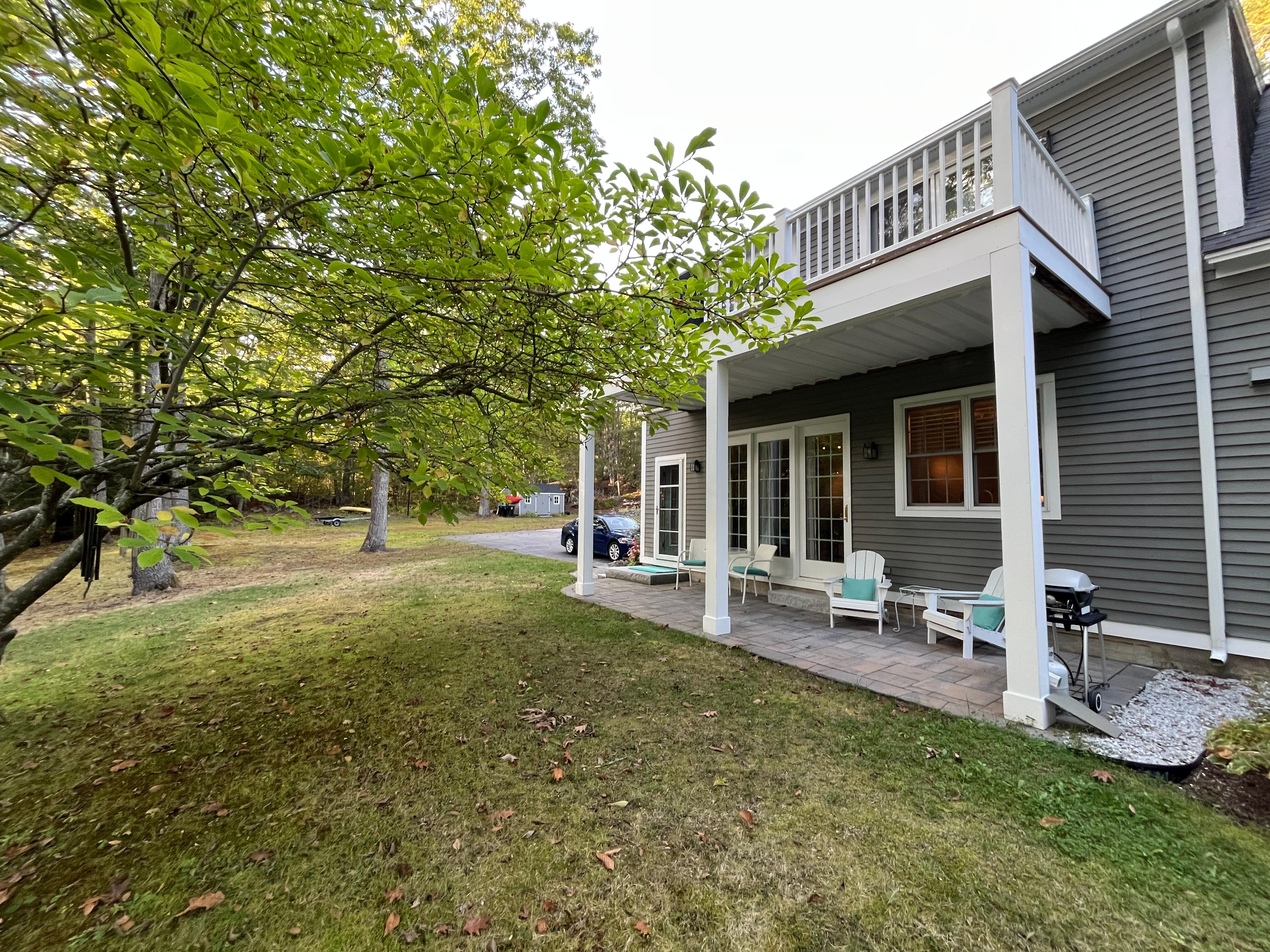 The patio is directly off of the living room and a private view of the river and woods. 