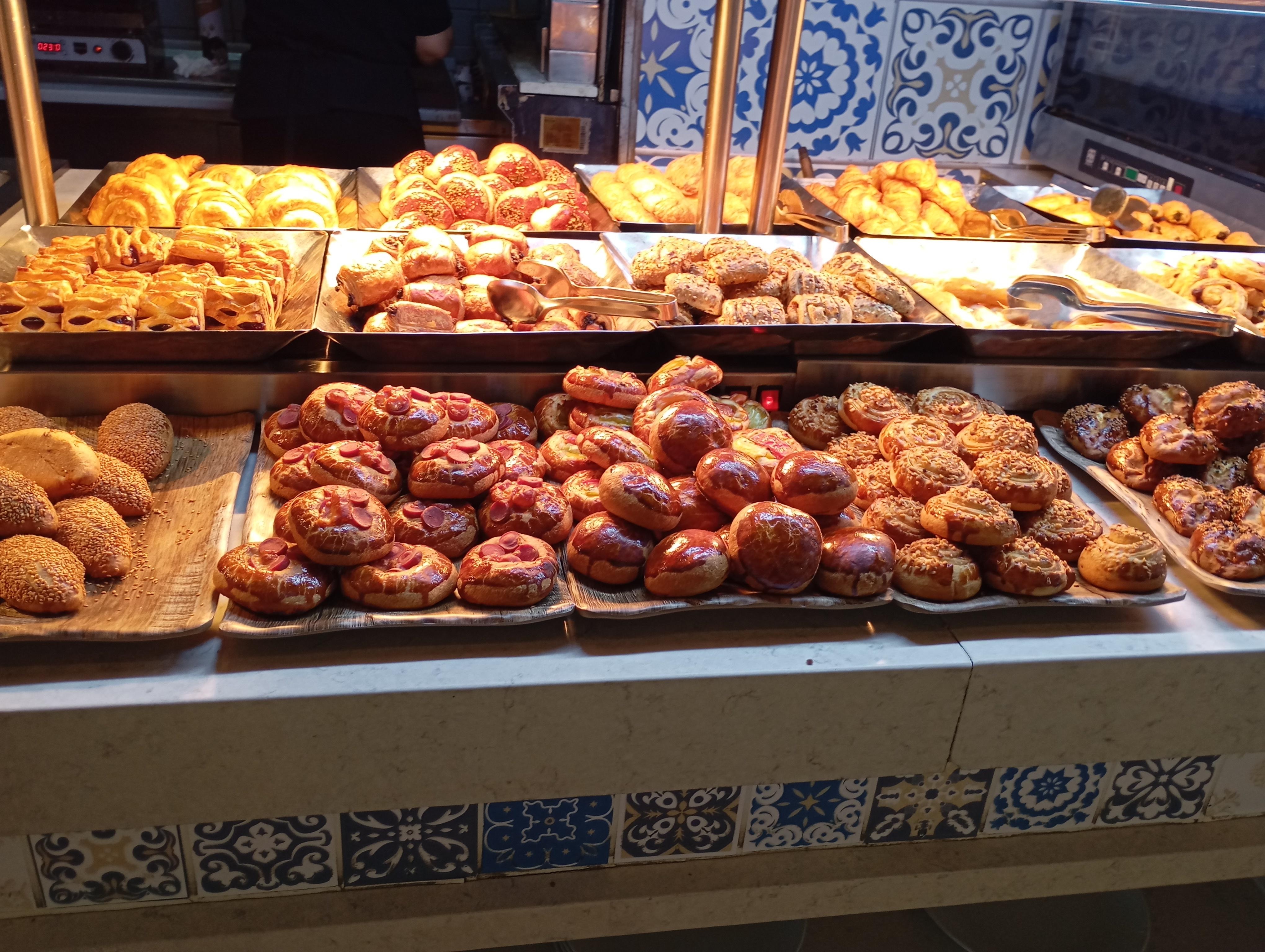 Tons of pastry and cheese selections with fresh fruits, yogurt and jam