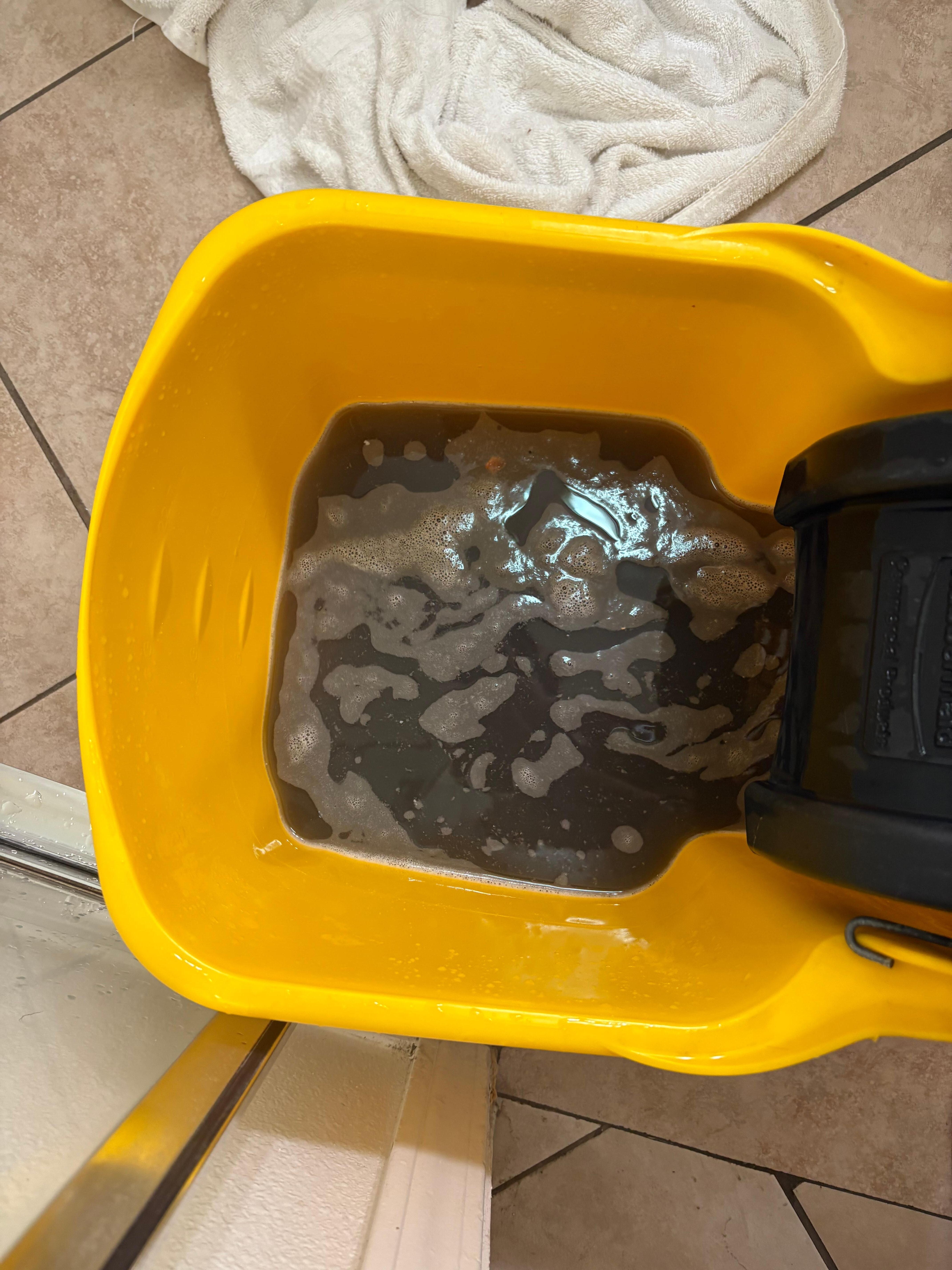The mop bucket after mopping floor once