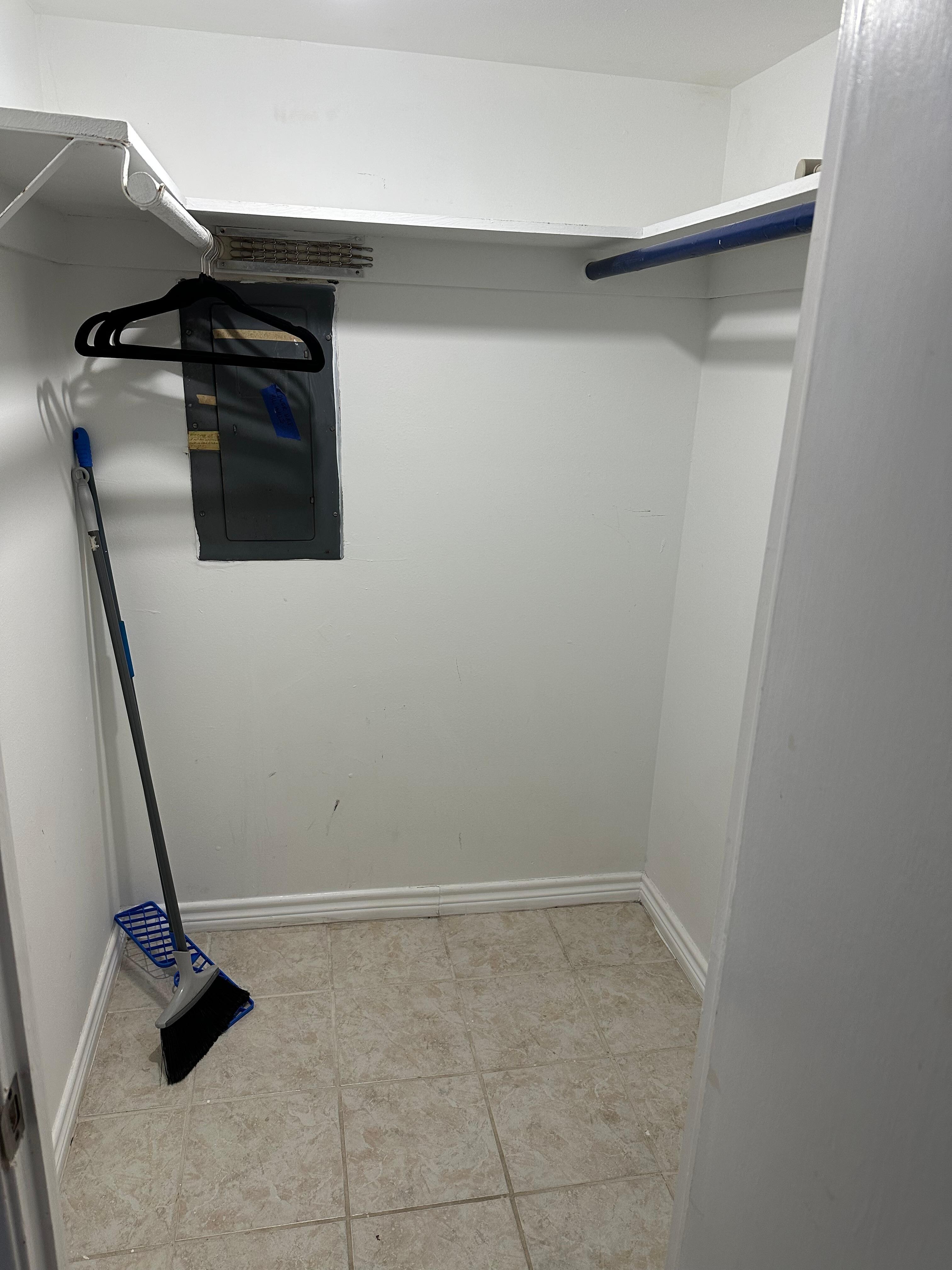 huge unusable closet that could have a washer dryer unit, and cheap broom with no dustapan