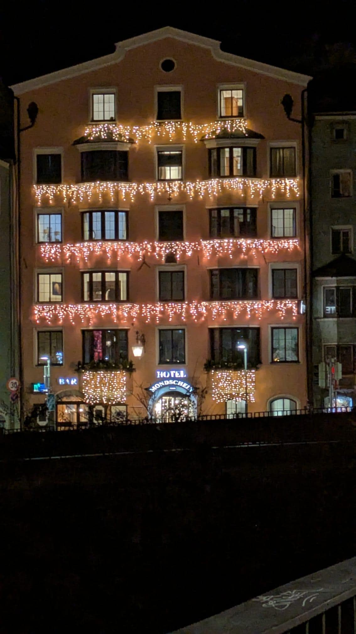 Hotel front with pretty lights.
