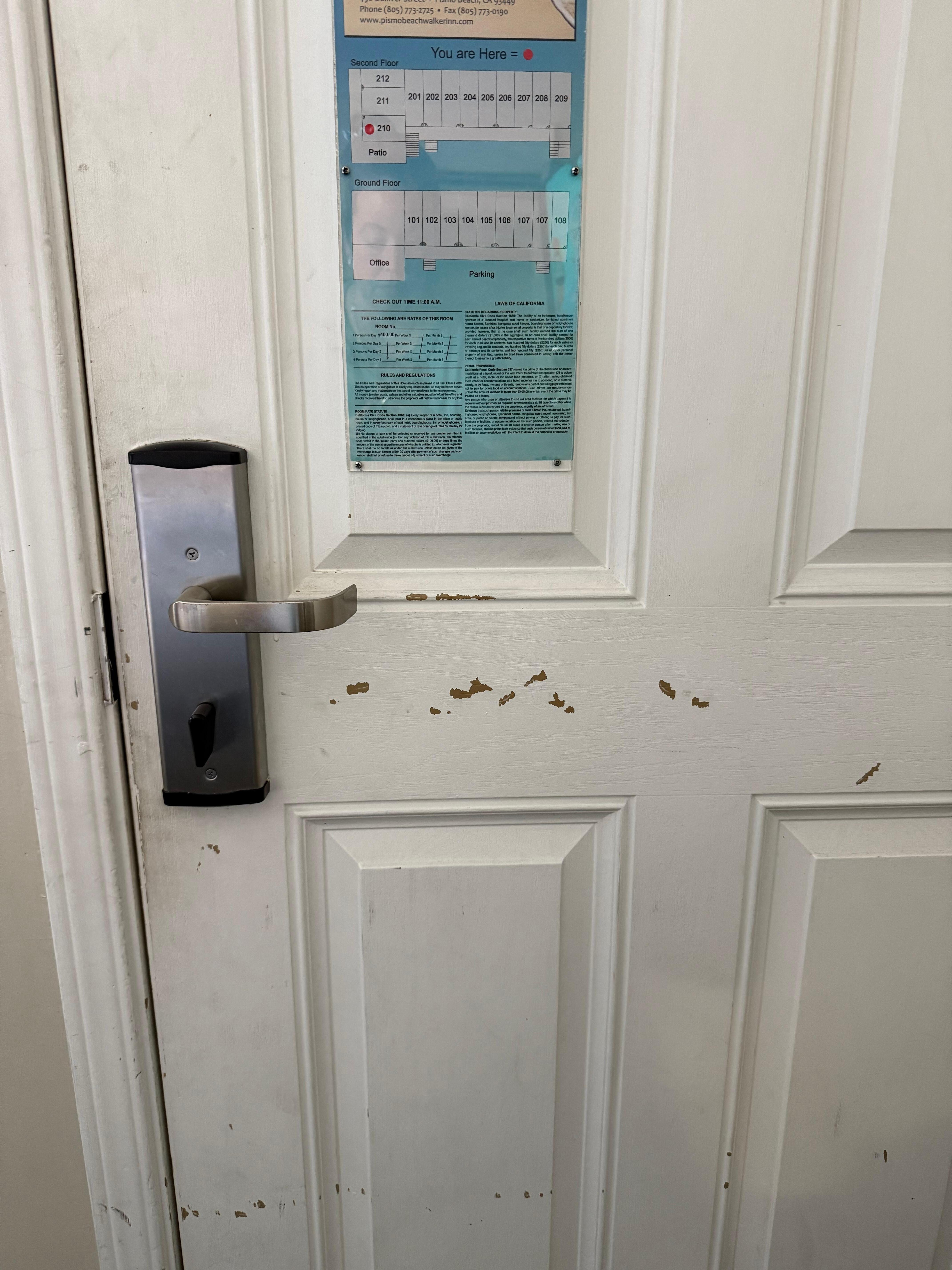 Beat up entry door with no additional safety lock. 