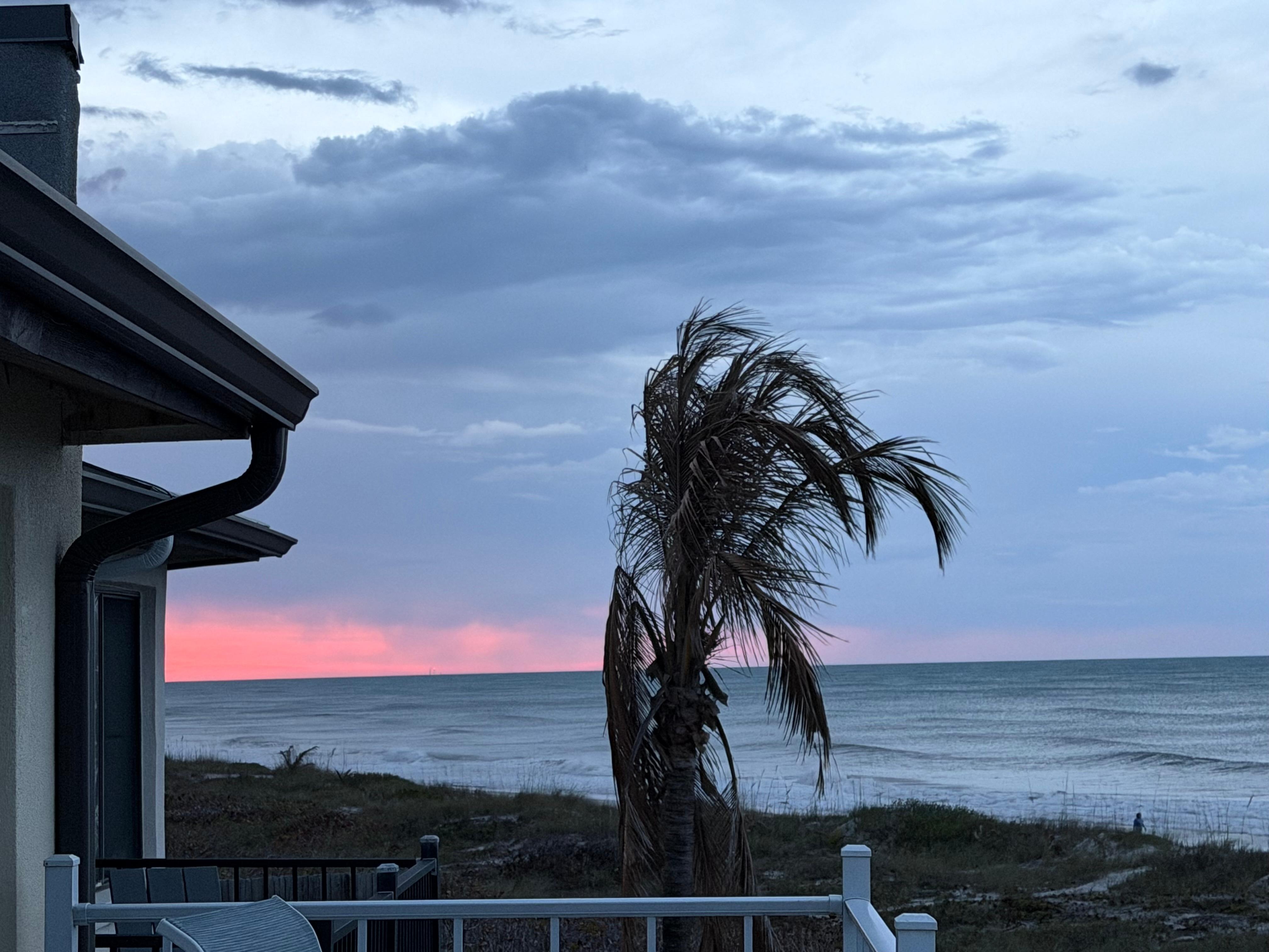 Rain clouds moving in with beautiful sunset. 