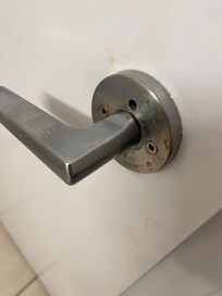 Grime on bathroom door handle