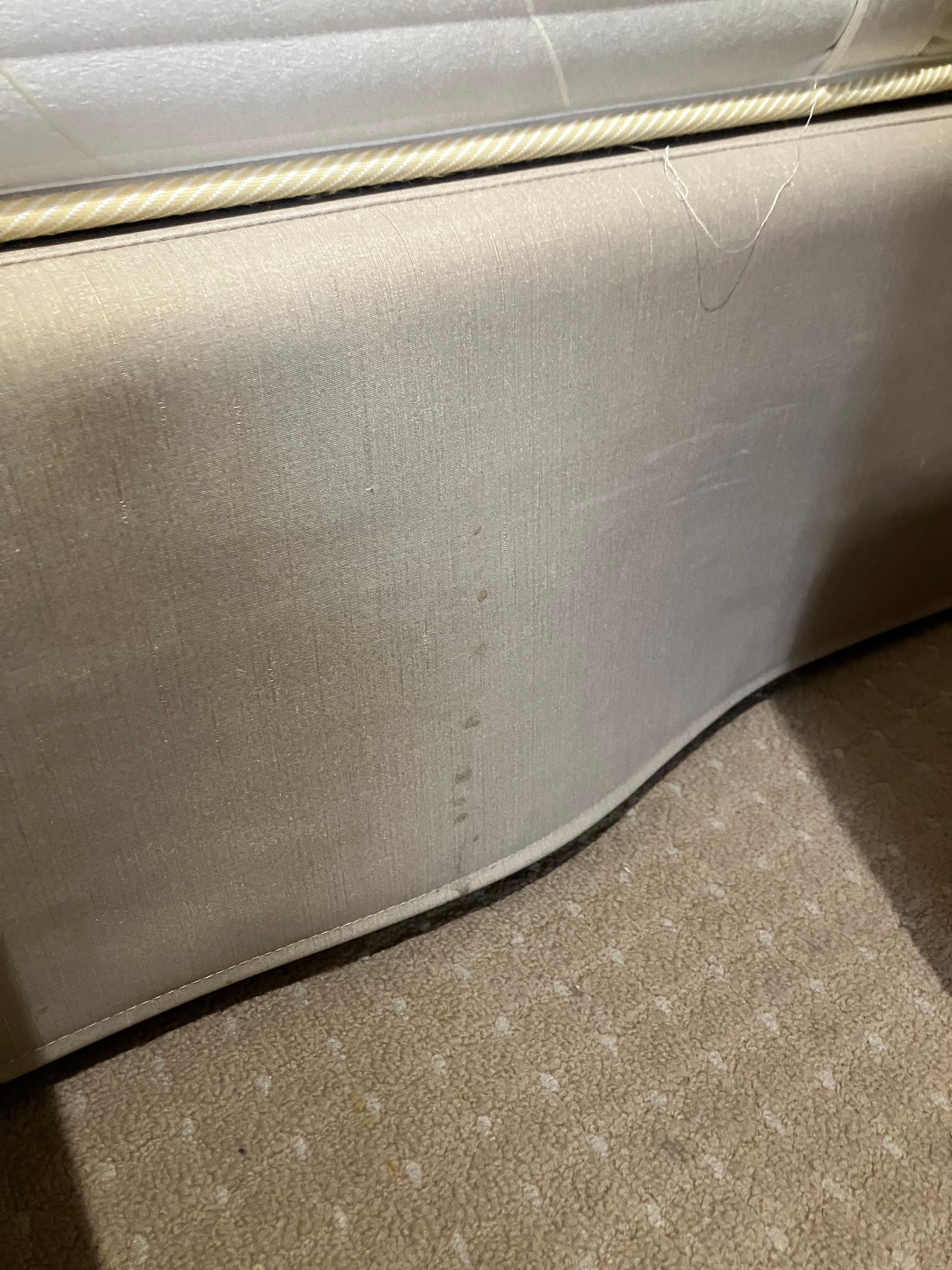 Stain on the side of the bed.
