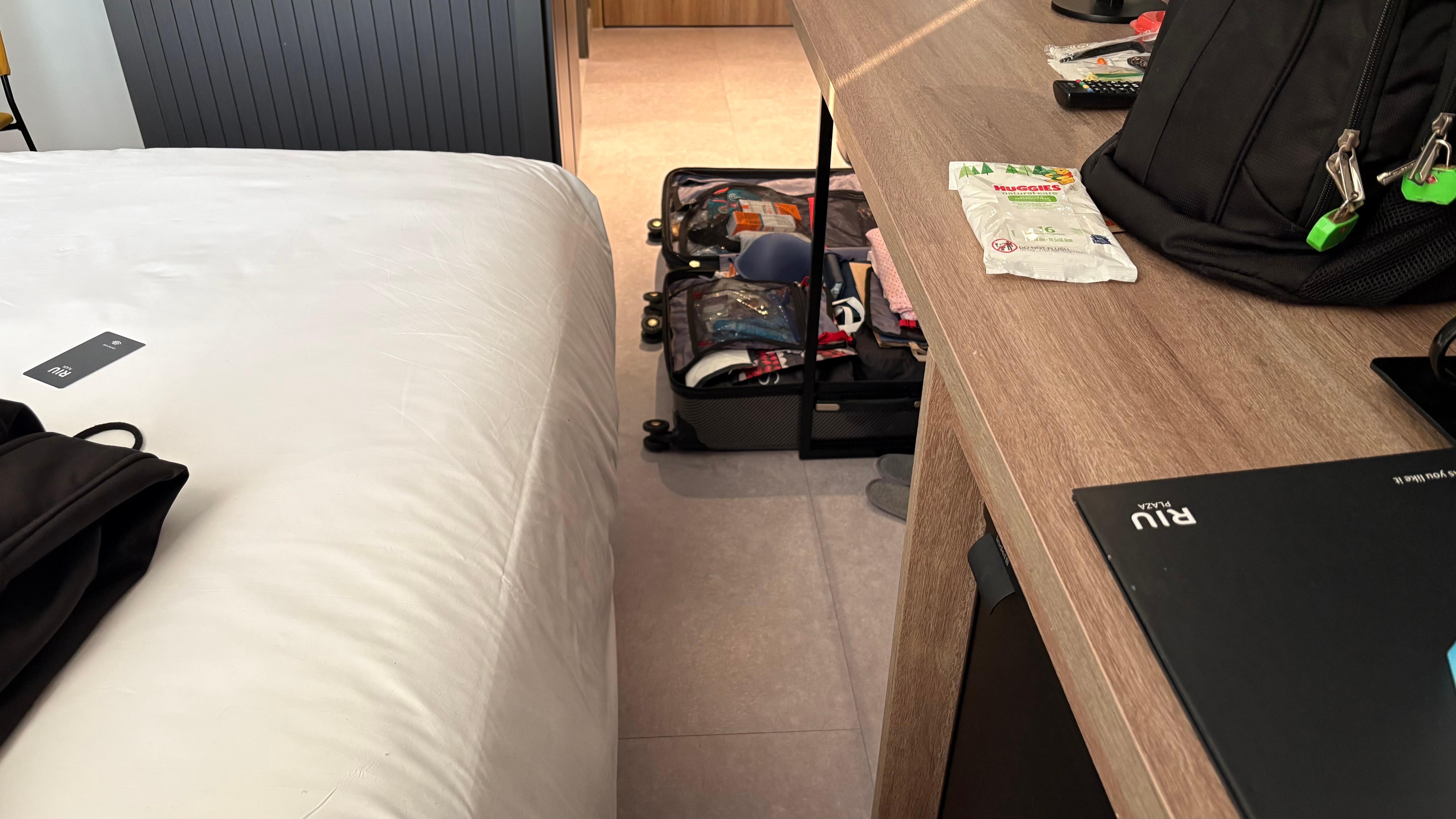 This is space between the bed and desk.  I moved the chair to reach the other of the side of the bed to close the curtains