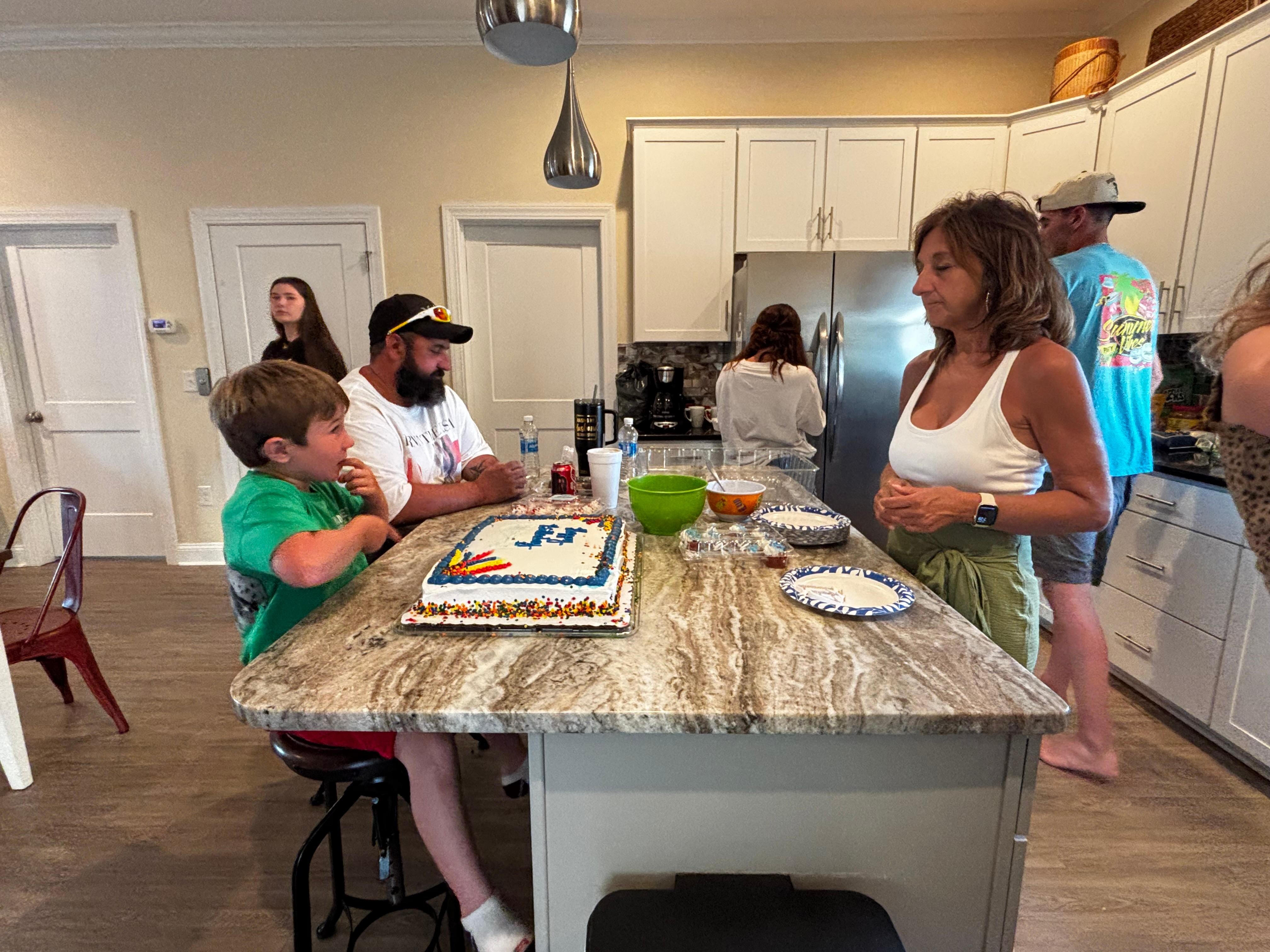Nice large kitchen and table with island seating as well 