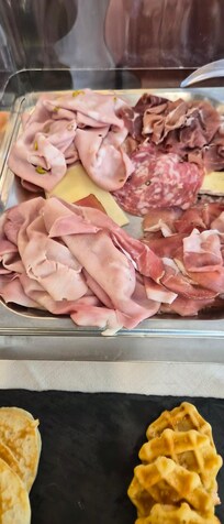 Cheeses "burried" amongst ham and salami.
