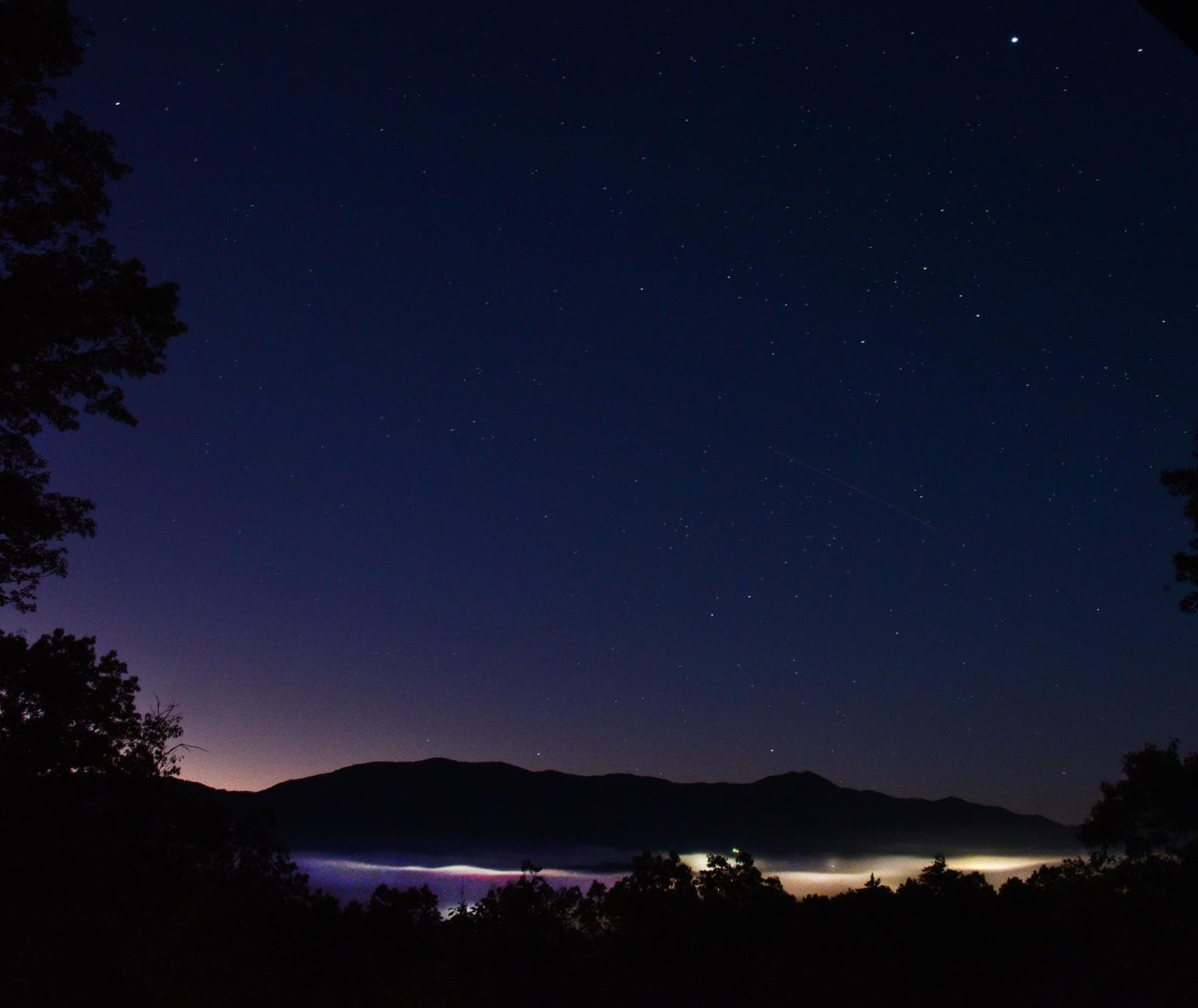 Starry pre-dawn from deck, with Bryson City fog below