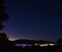 Starry pre-dawn from deck, with Bryson City fog below