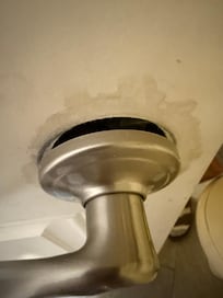 Broken door handle on a delaminated door