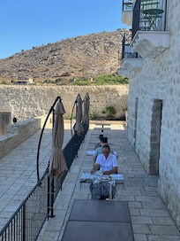 Front of hotel in the morning with breakfast tables laid