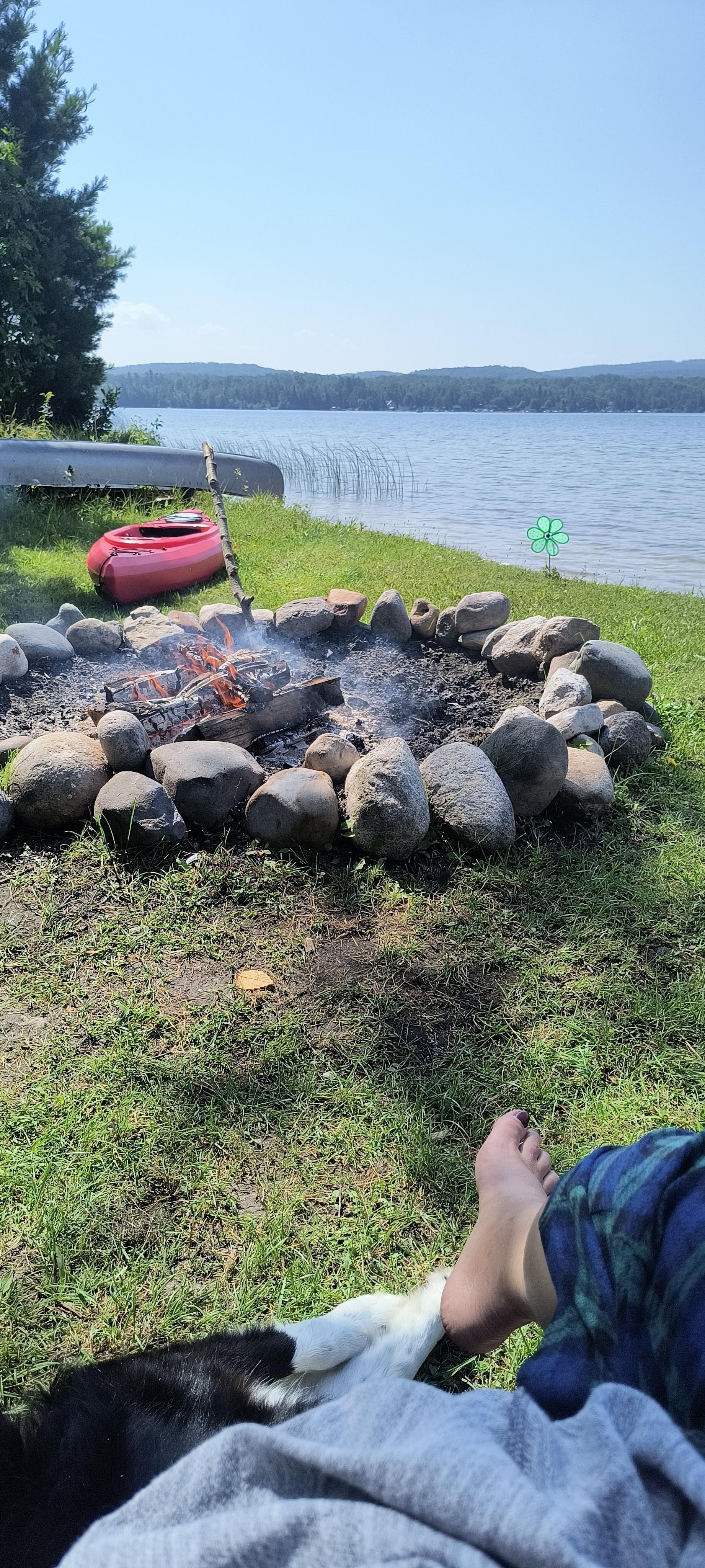 Morning coffee with a fire, the dogs, and watching my daughter toodle around the lake in the kayak. Life is good!