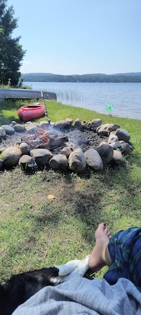 Morning coffee with a fire, the dogs, and watching my daughter toodle around the lake in the kayak. Life is good!