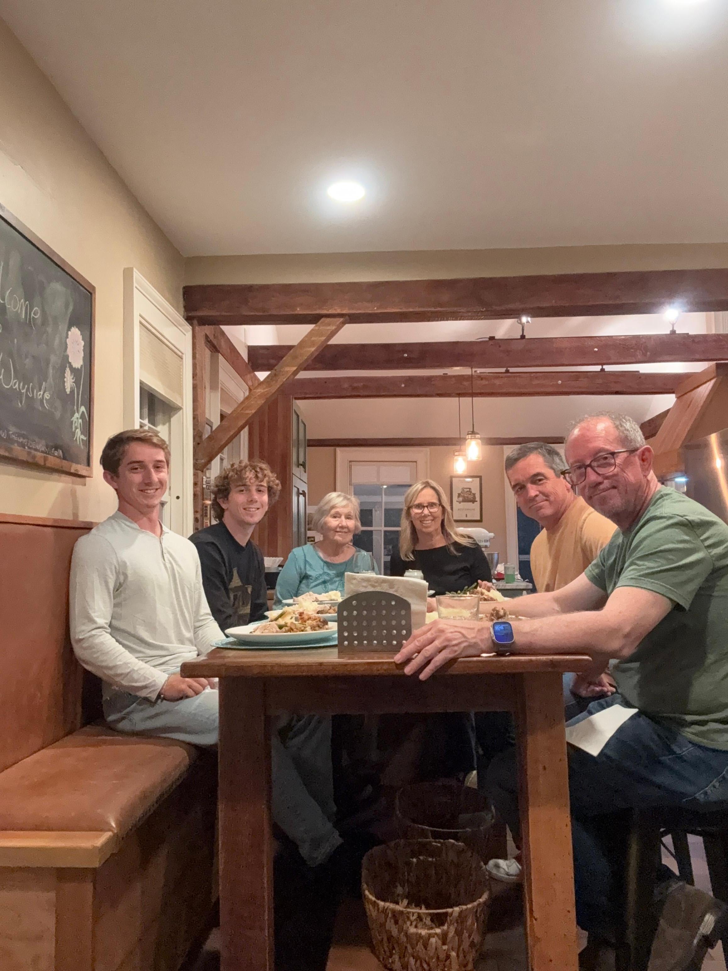 Playing a game of spades at the kitchen table. 