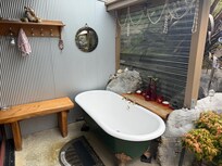 Lovely private old fashion tub if you wanted to soak outside taking in nature.