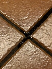 Water on floor from leaking sink