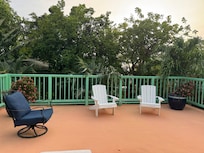 Patio by upstairs bedrooms.