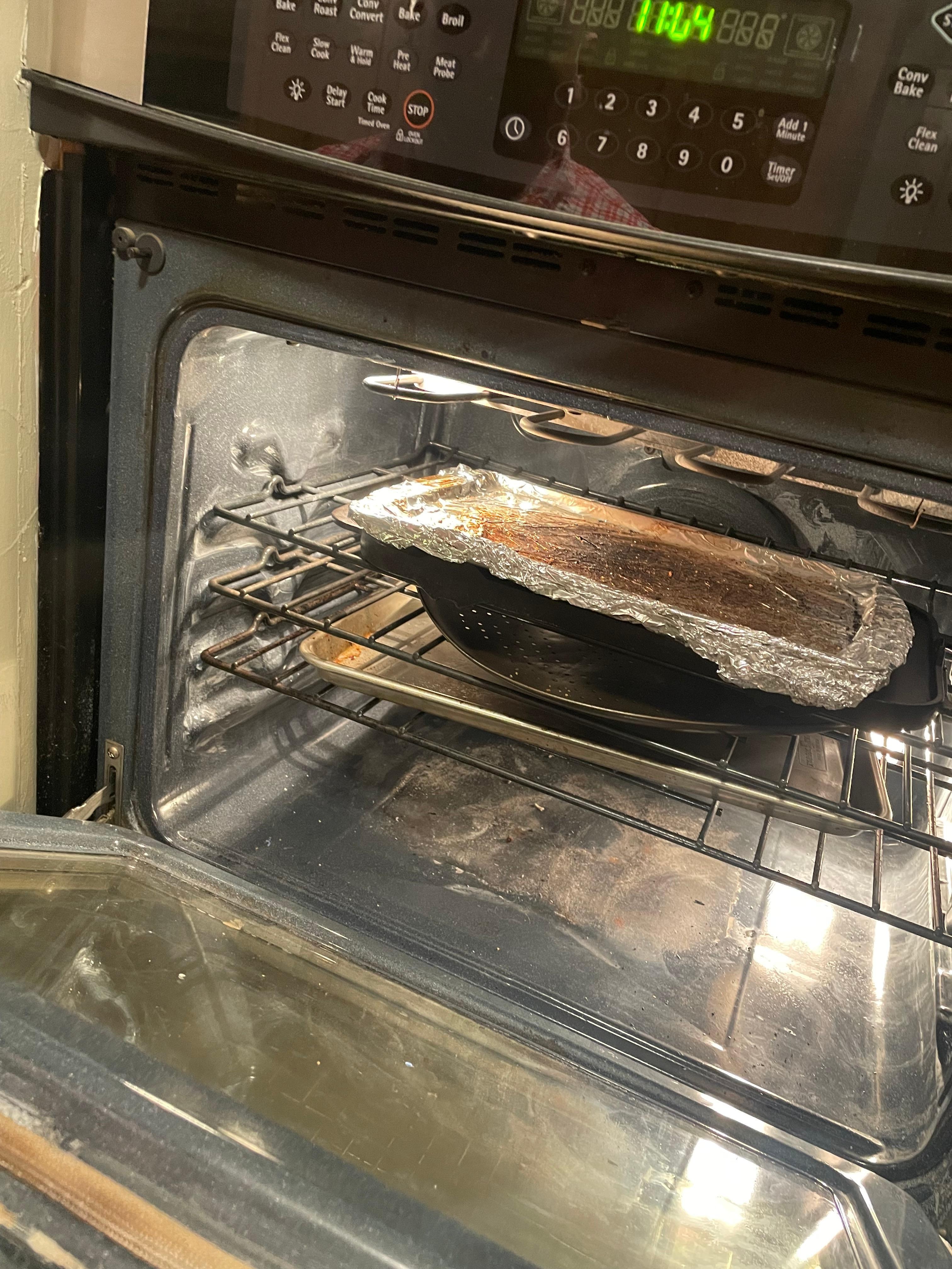 Dirty dishes in dirty oven