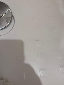 Cheveux ou poils dans le bac de douche