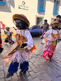 Festival passes by the hotel.