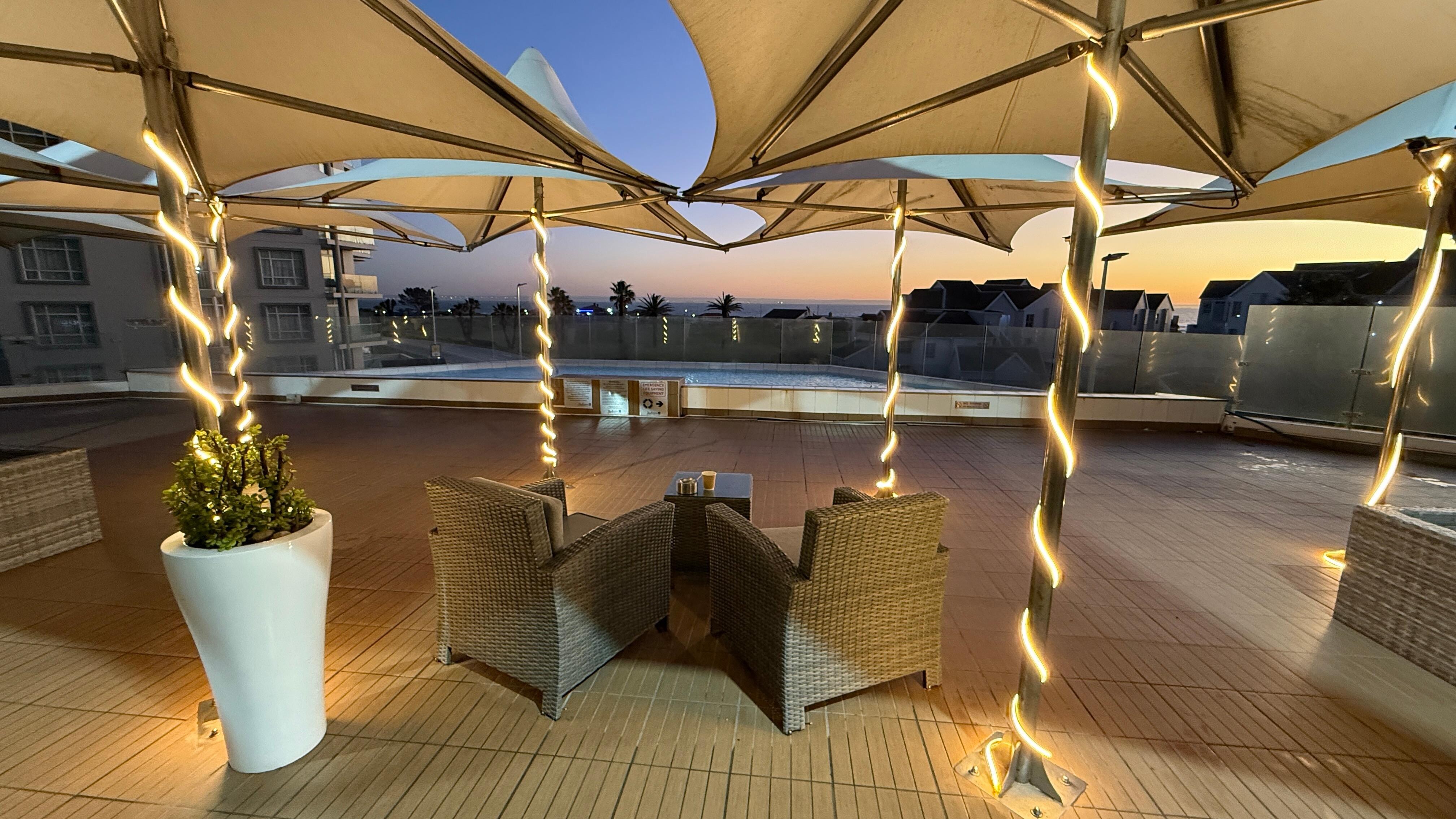 Sunrise view of ocean across pool deck view 1