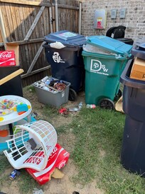 Trash piles up outside