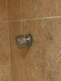 Bathroom shower heads were coming of the wall