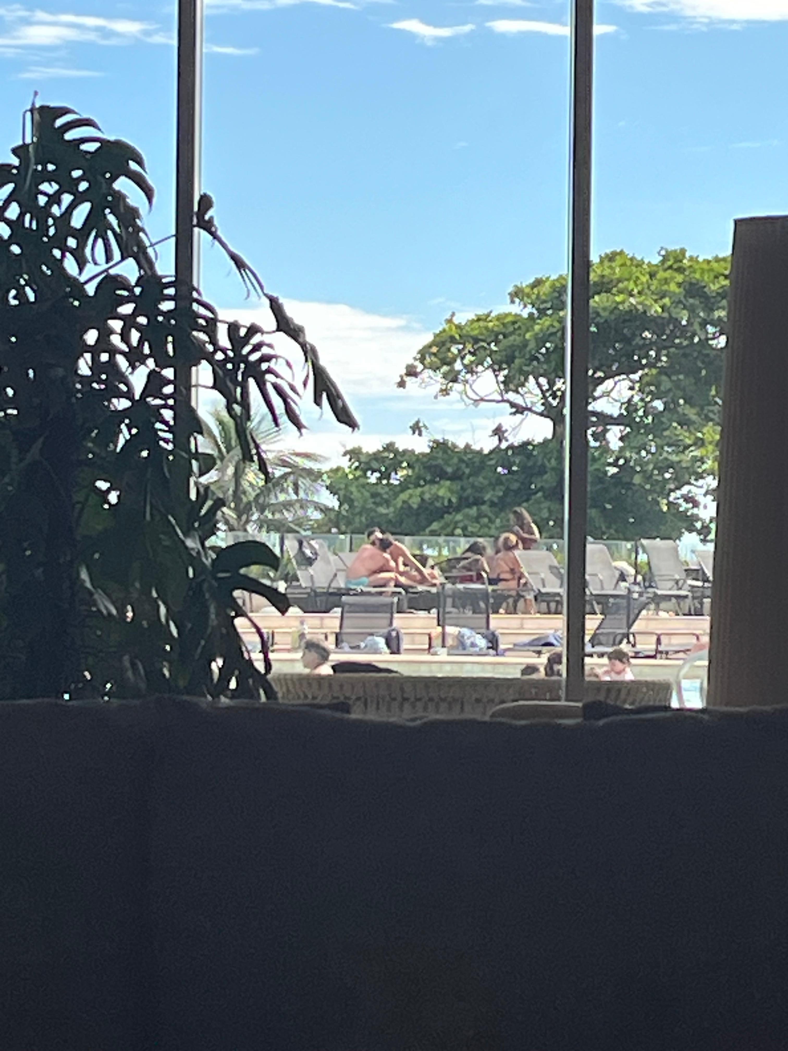 Two full grown adults , two men are kissing hard. 
Kids are in the pool !!! Disgusting! 