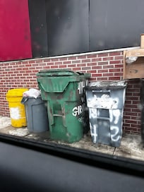 in front of the house, we could smell this trash inside the house